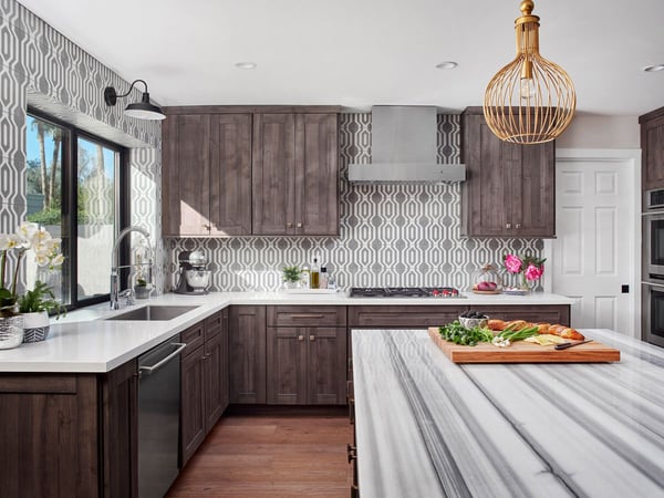 Kitchen remodeling project that features a bold geometric pattern backsplash around the walls