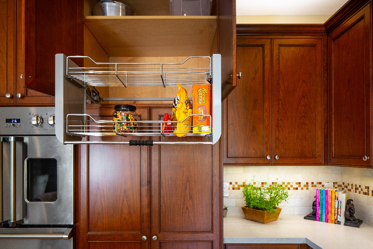 Sliding Pantry Rack embedded into the higher cabinets next to the stove
