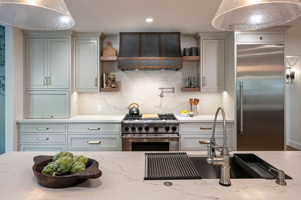 clean and crisp kitchen remodeling project with lots of storage, built in range, and a marble backsplash