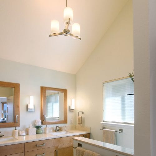 Newly painted bathroom walls with a high ceiling