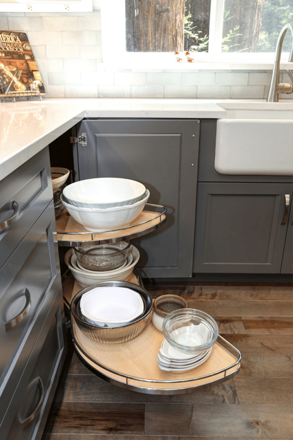 Corner cabinets with pull out and retractable shelves for storing mixing bowls