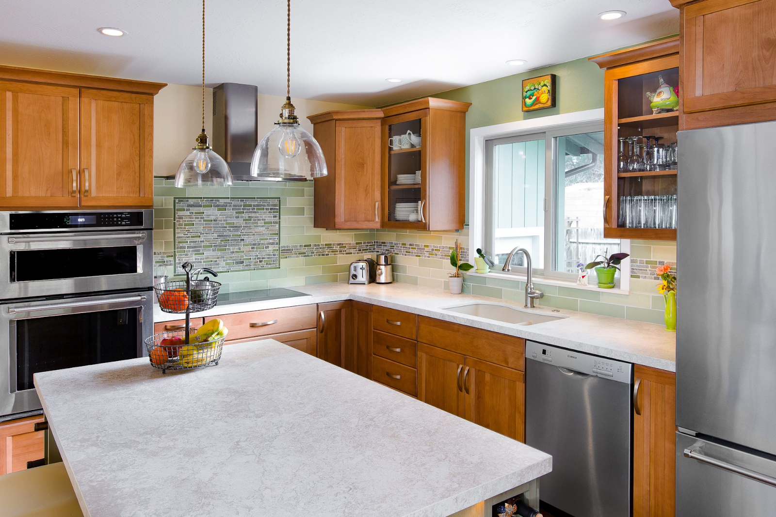 Contemporary and warm kitchen remodel with a mixture of silver and gold metal finishes