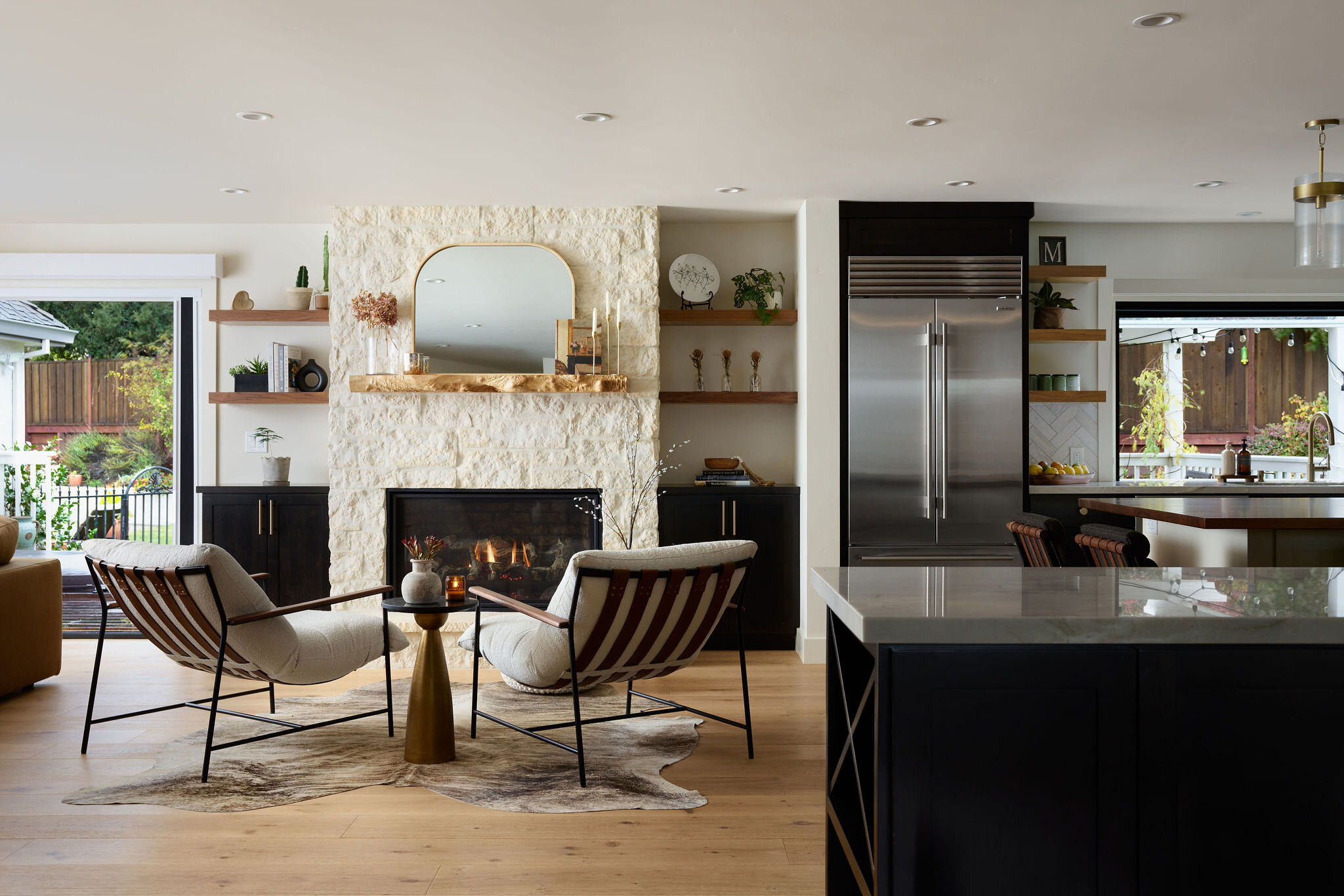Pure and clean home remodel with a kitchen and living room visible from the dining room.