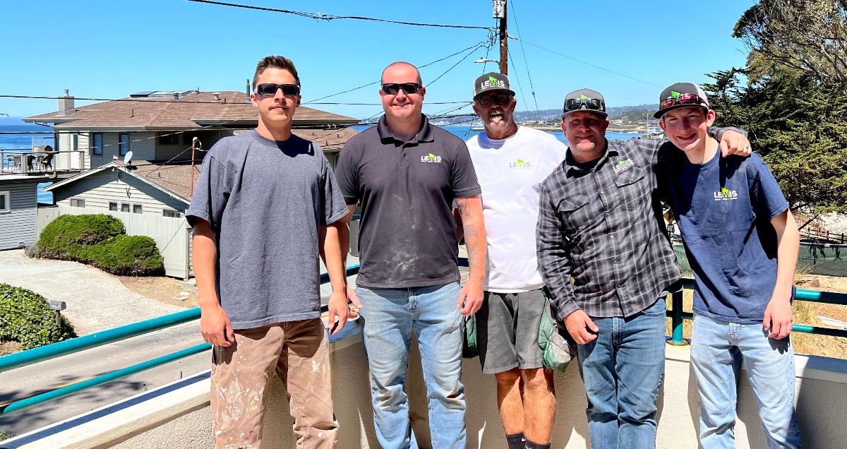 Jared Lewis standing with several employees at Lewis Design Build Remodel