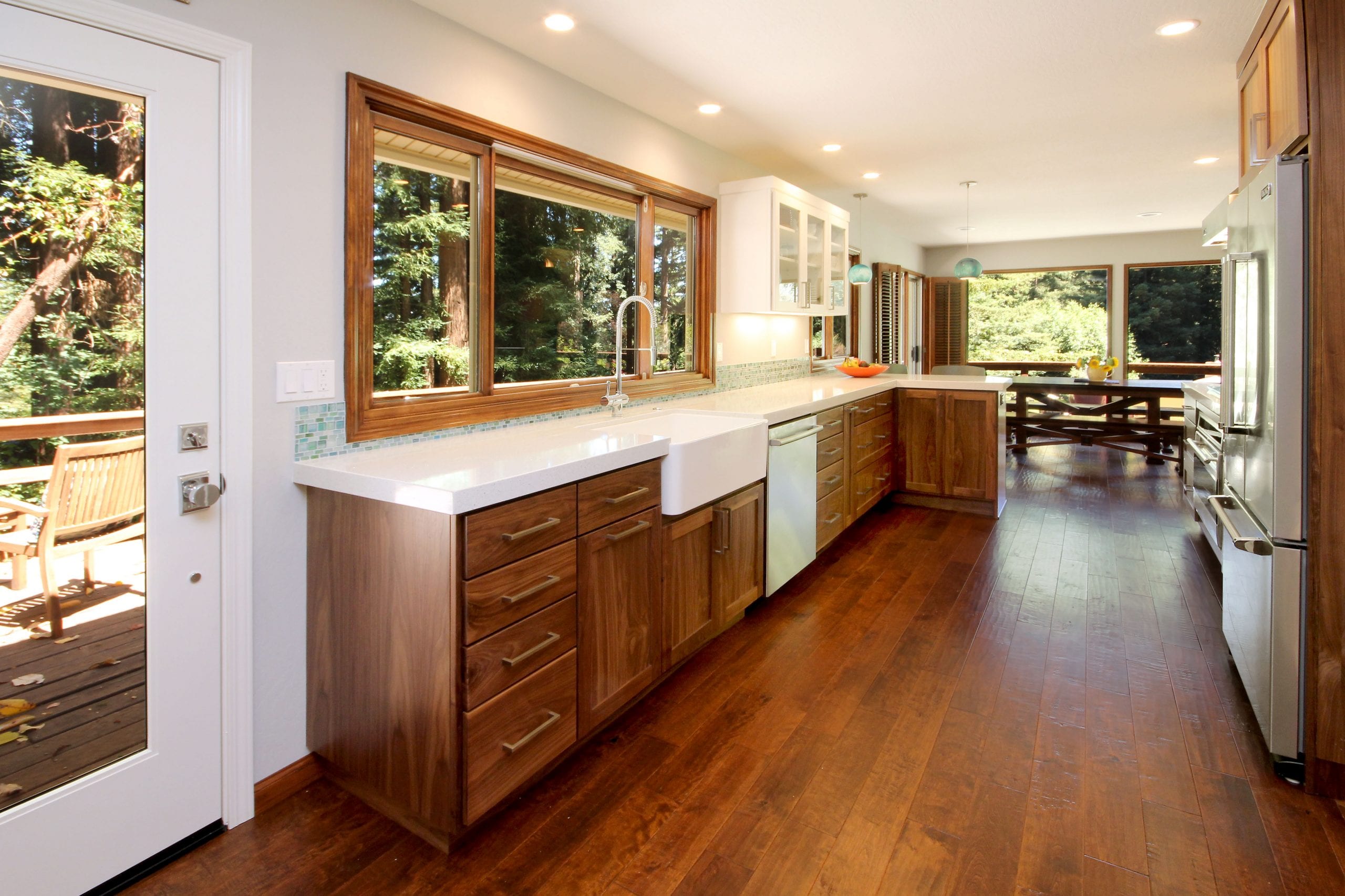 Kitchen remodel after with open footprint and hardwood flooring