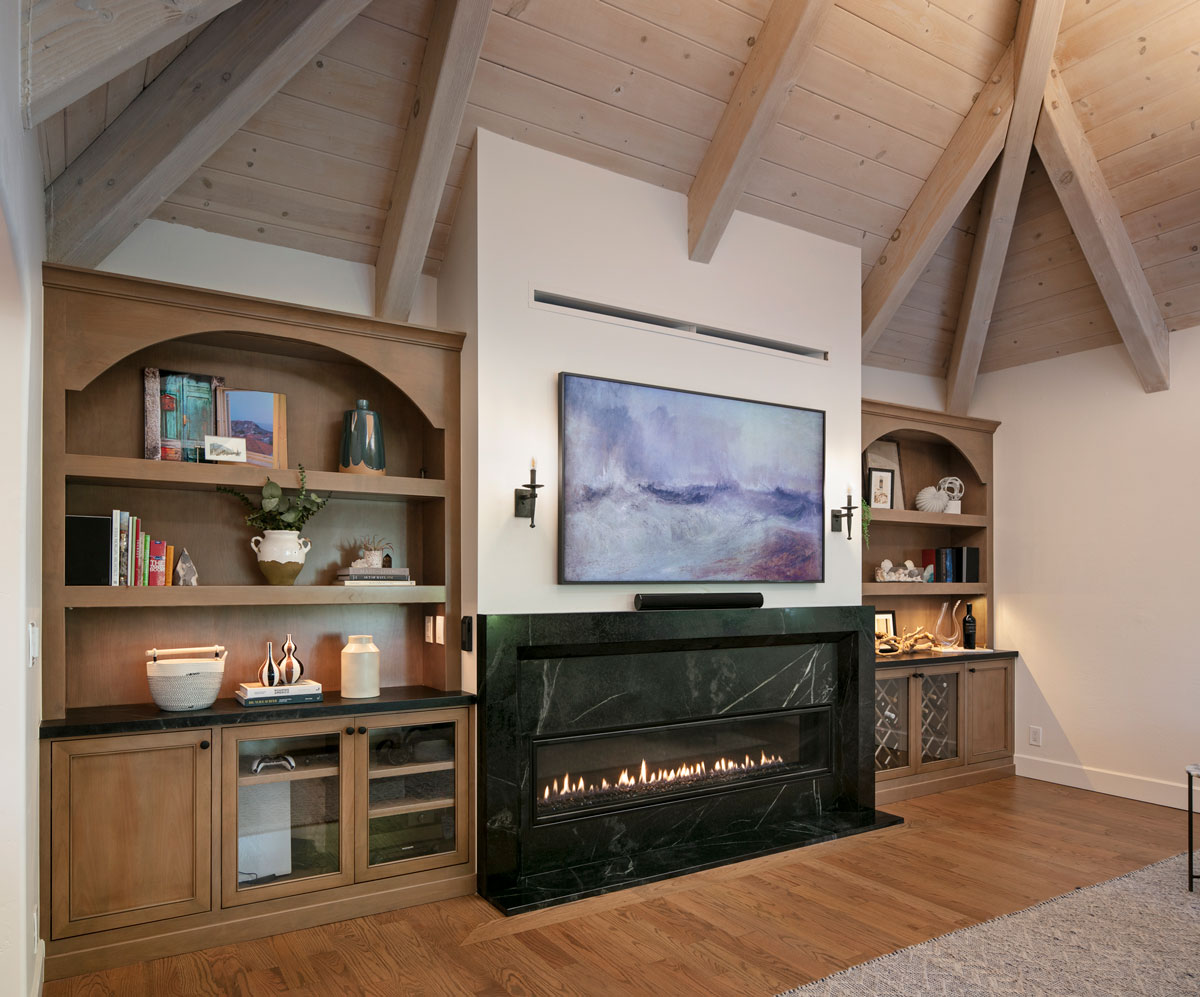 Fireplace with vaulted ceiling above