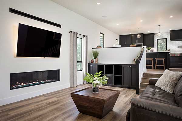 Kitchen and living room with built-in fire place and wall mounted television