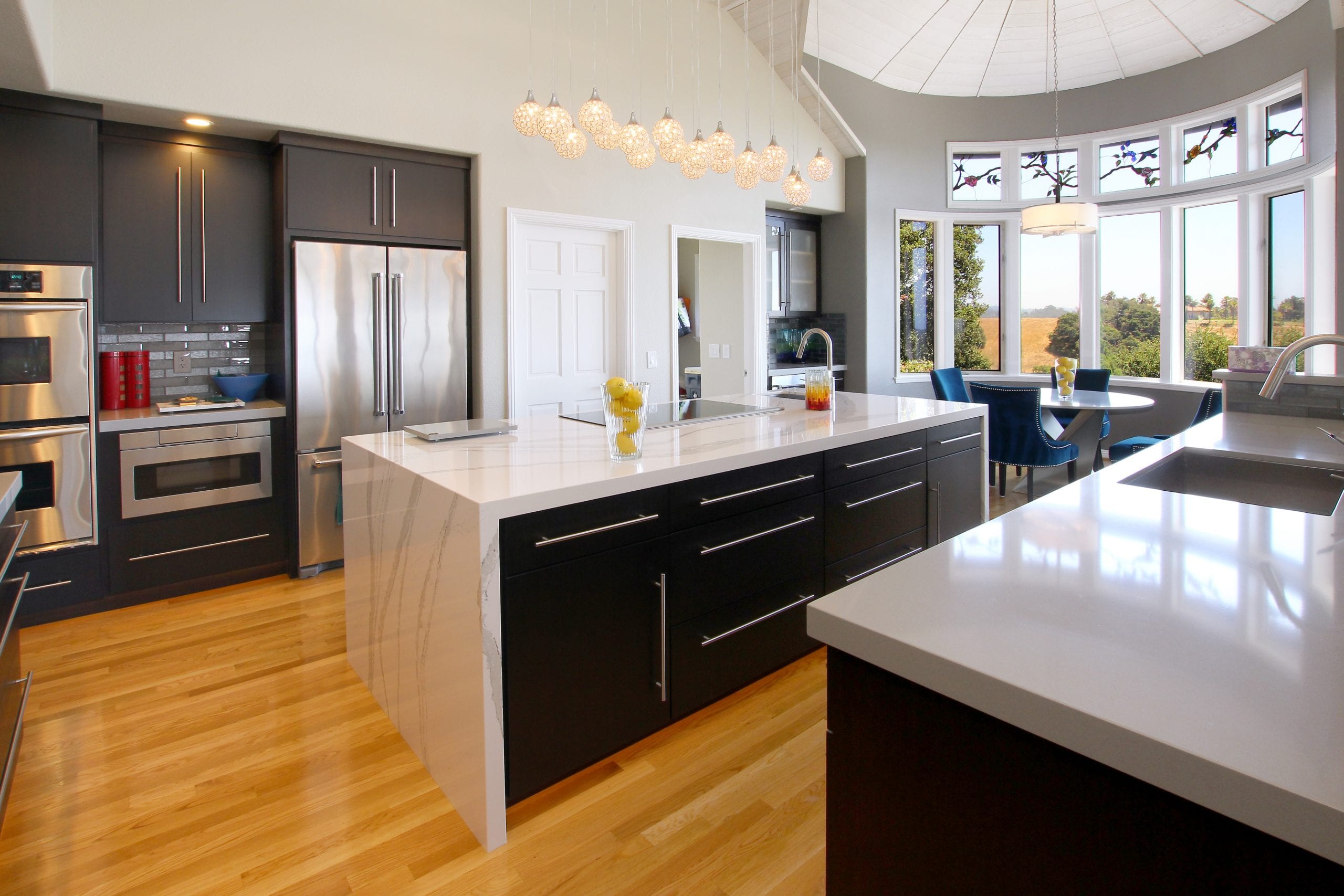 Beautiful and elegant kitchen with many safety design features, such as anti-slip flooring, mitered edge marble counter tops, and plenty of light