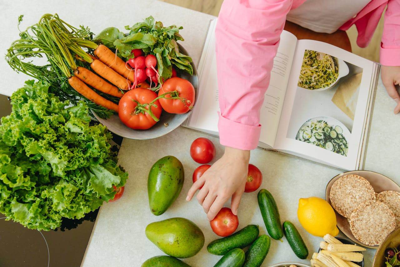 Woman organizing her various vegetables on the kitchen counter to prep before cooking in her kitchen