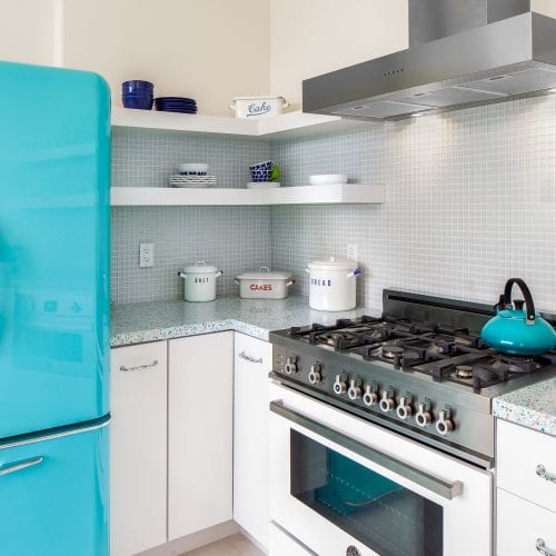 Kitchen with bright blue retro refrigerator