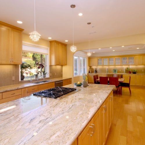 Granite kitchen counter tops with lightwood trim