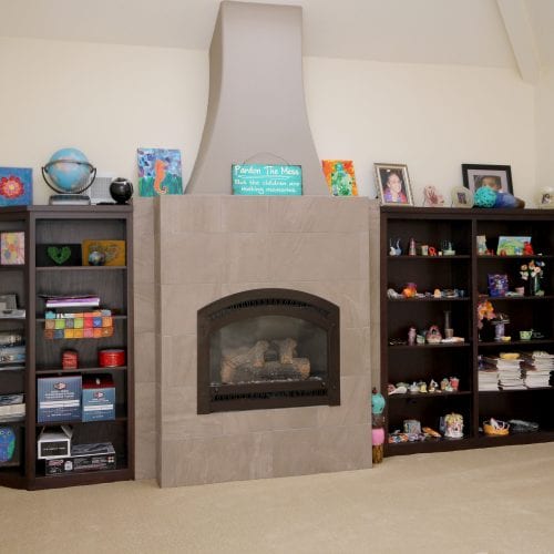 Stone fireplace with bookcases on each side