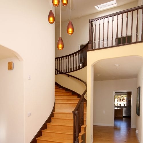Staircase with glass bronze hanging lights