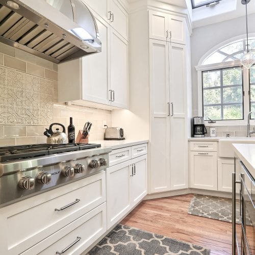 Stainless steel stovetop with silver dials