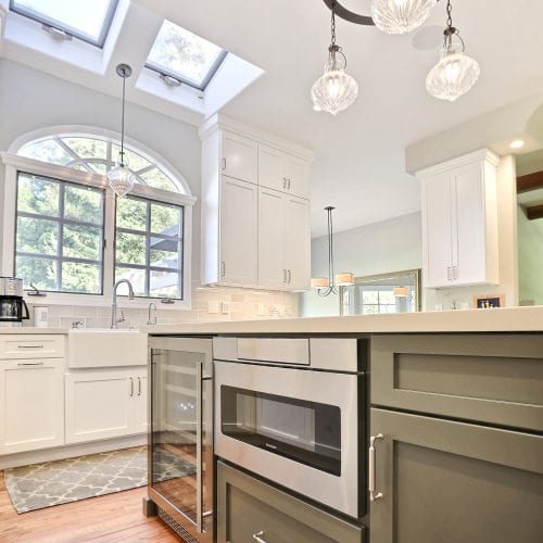 Metal microwave embedded into kitchen island