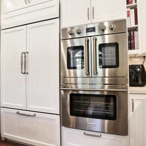 Stainless steel double door over on top of conventional oven