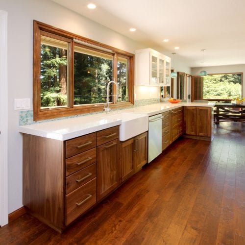 Kitchen countertop with contrasting hardwood cabinetry and flooring