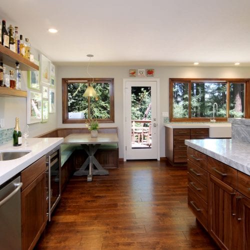Open floor plan kitchen remodel with polished hardwood flooring and lots of natural light