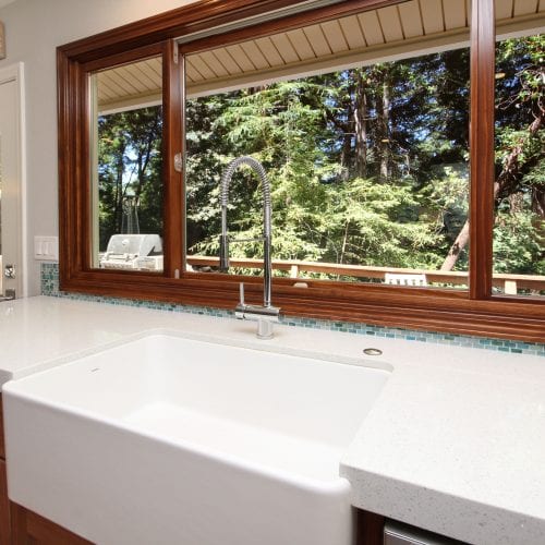 White granite countertops with built-in kitchen sink