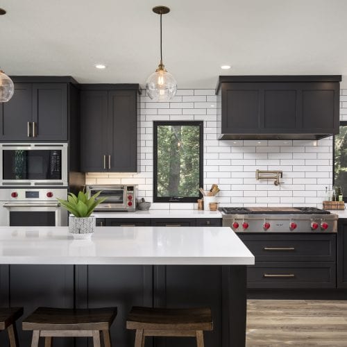 Black and white kitchen with tile backsplash