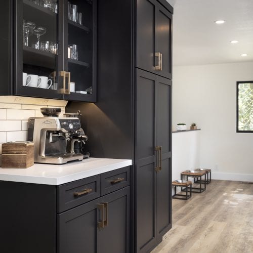 Black wooden storage cabinets with counter cut-out