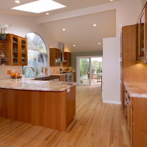 Kitchen with hardwood floor and wooden cabinets