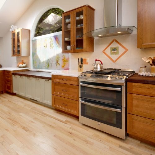 Kitchen with stainless steel over and hardwood floor