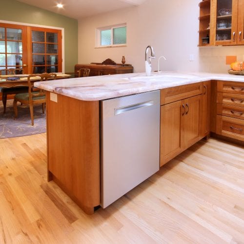 Stainless steel dishwasher embedded under kitchen counter