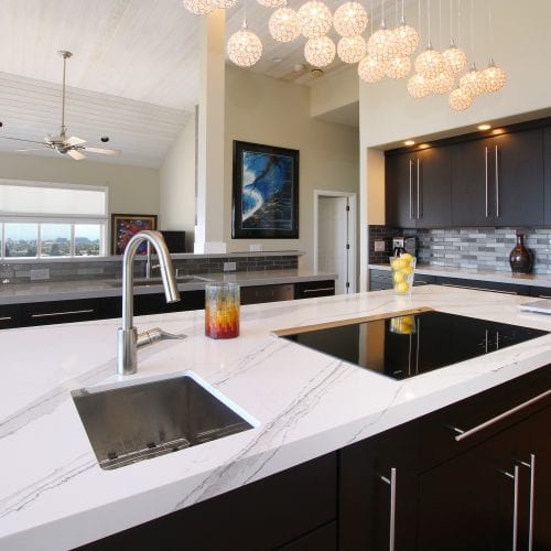 Stainless steel sink and faucet embedded into countertop