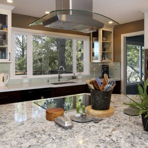 Kitchen with stainless steel and glass exhaust vent