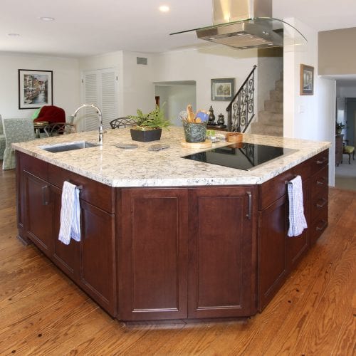 Kitchen island with rich dark wood cabinets