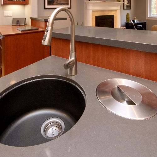 Kitchen island with circular embedded sink