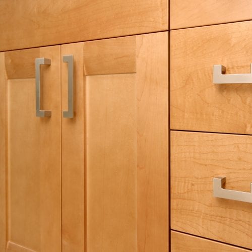 Close up of bathroom cabinet doors and handles