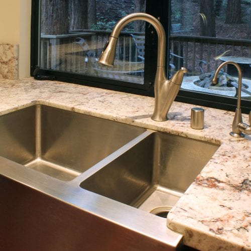 Stainless steel kitchen sink with granite countertops