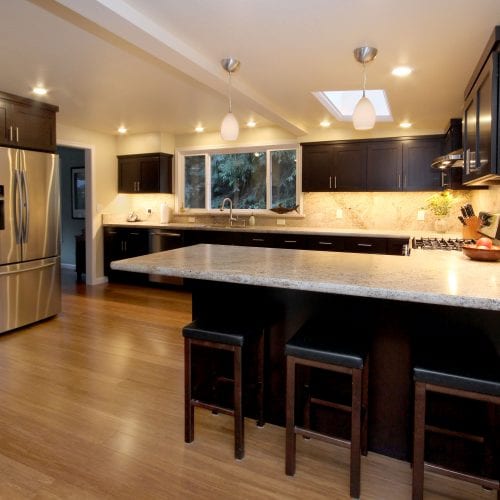 Kitchen island with black leather topped stools