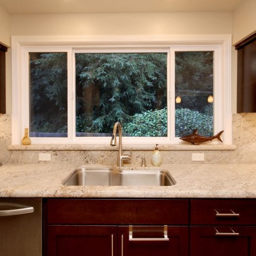 Wide kitchen window with white frames