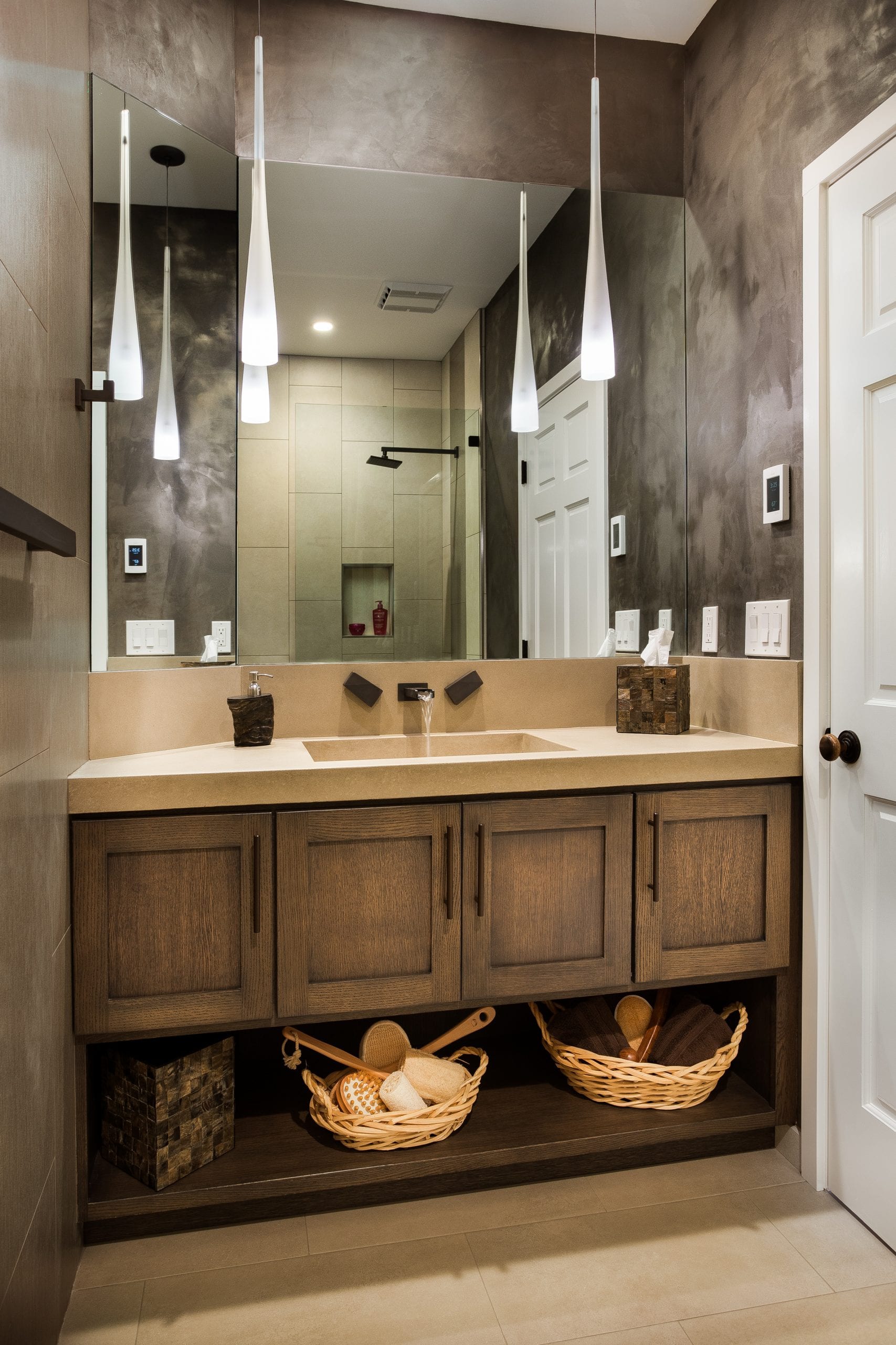 Bathroom counter with baskets underneath for storage