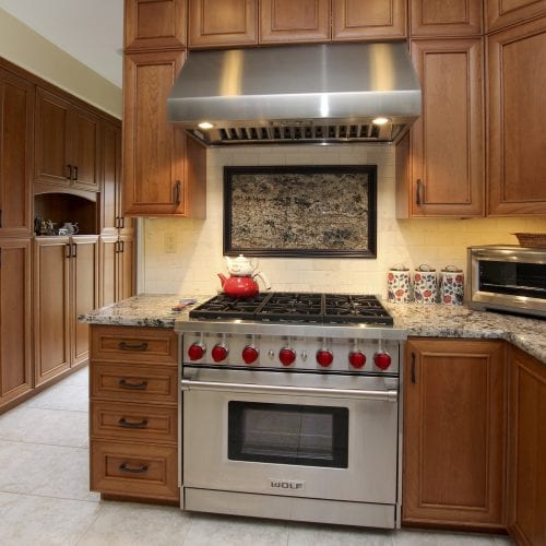 Stainless steel oven with accompanying exhaust hood