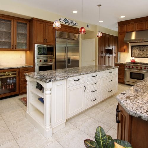 Epicurean kitchen with wooden cabinets and stainless steel appliances