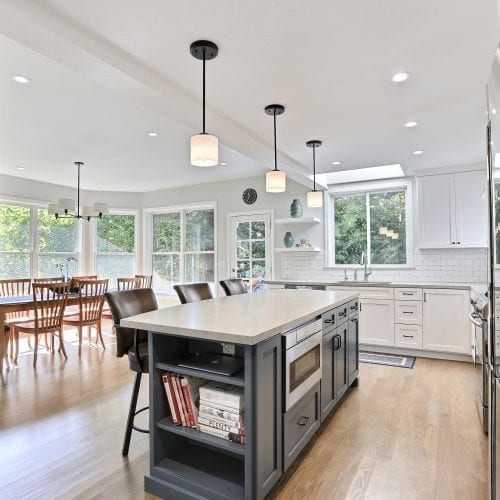 Kitchen island with three hanging lights above the countertop