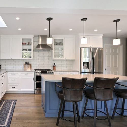 Kitchen with blue painted wood cabinets