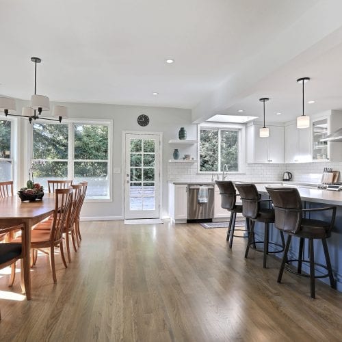 Kitchen with wide open wood flooring