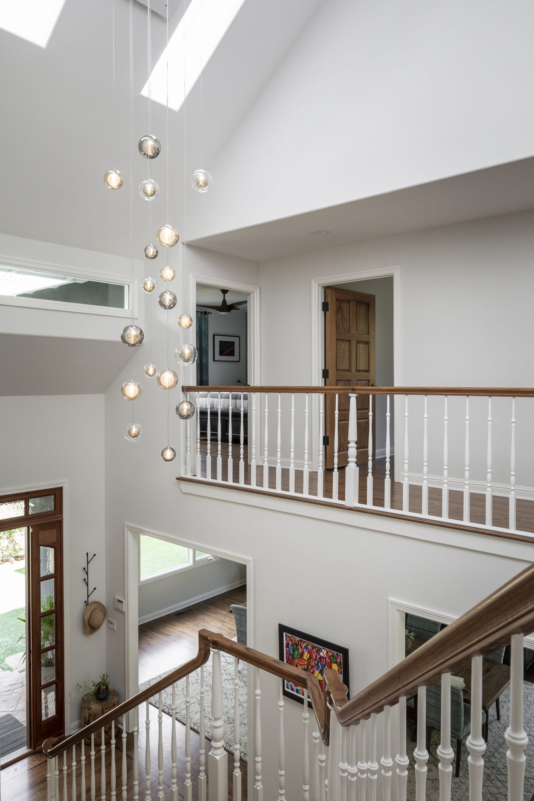 Upper level looking over front entrance with wood banister