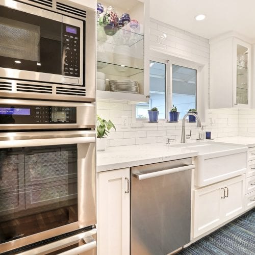 Stainless steel microwave mounted above oven