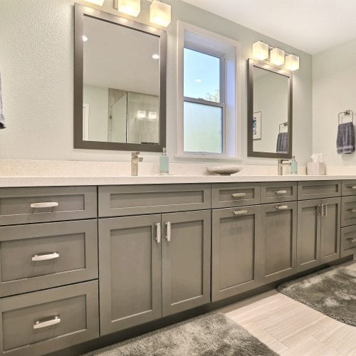 Bathroom with two mirrors and frosted window in the middle