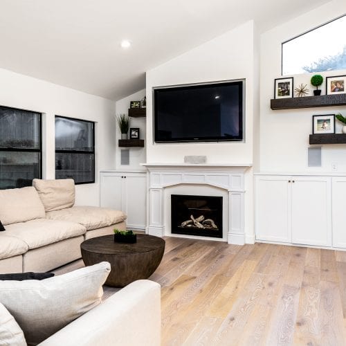 Living room with fireplace and wall mounted television