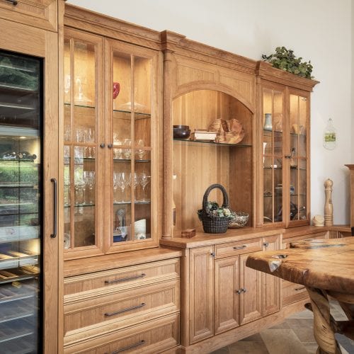 Wooden cabinets with glass panels and arched cover