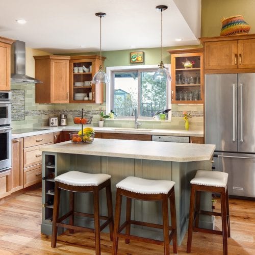 Kitchen with island and white leather stools