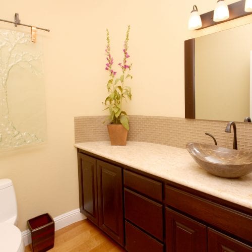 Bathroom counter with green and purple flower