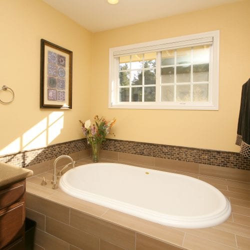 Bathroom tub with window above for natural light